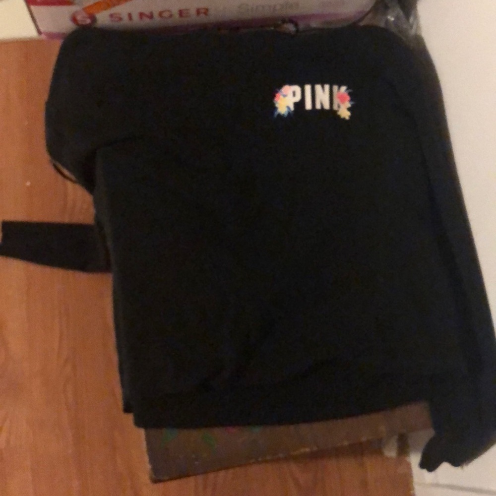 It’s a crop sweatshirt from pink with and open cut in the back came that way .
